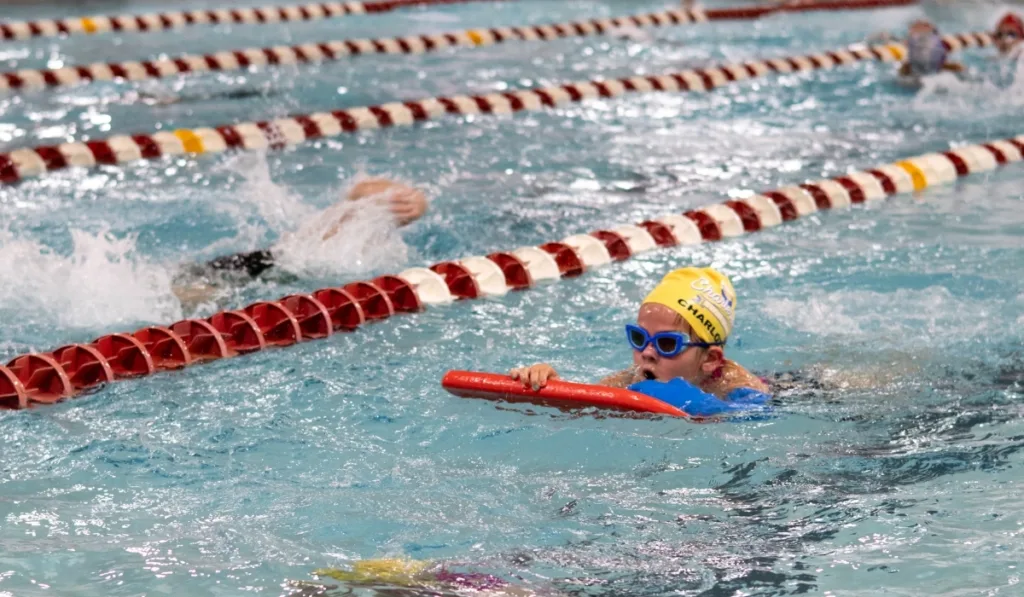 Child swimming inside indoor pool at Boyertown Y