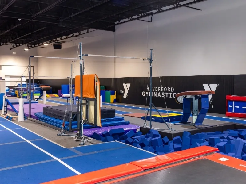 Foam pit and uneven bars inside Haverford Y's Gymnastics Center