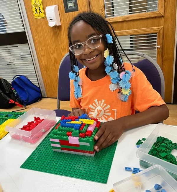 Child playing with LEGOs
