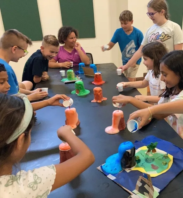Children making volcano craft in STEM program