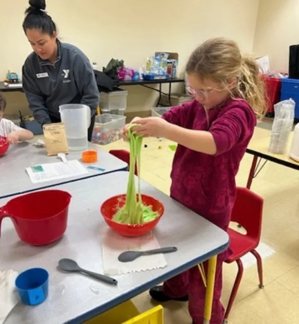 Child making slime in STEM program