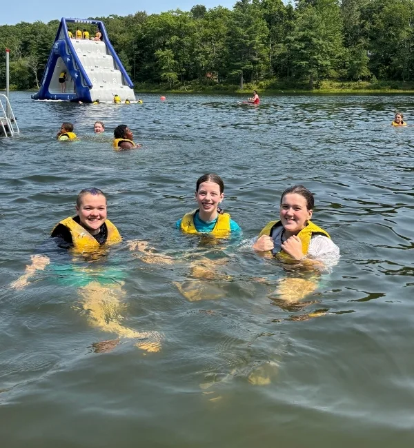 Campers swimming in lake