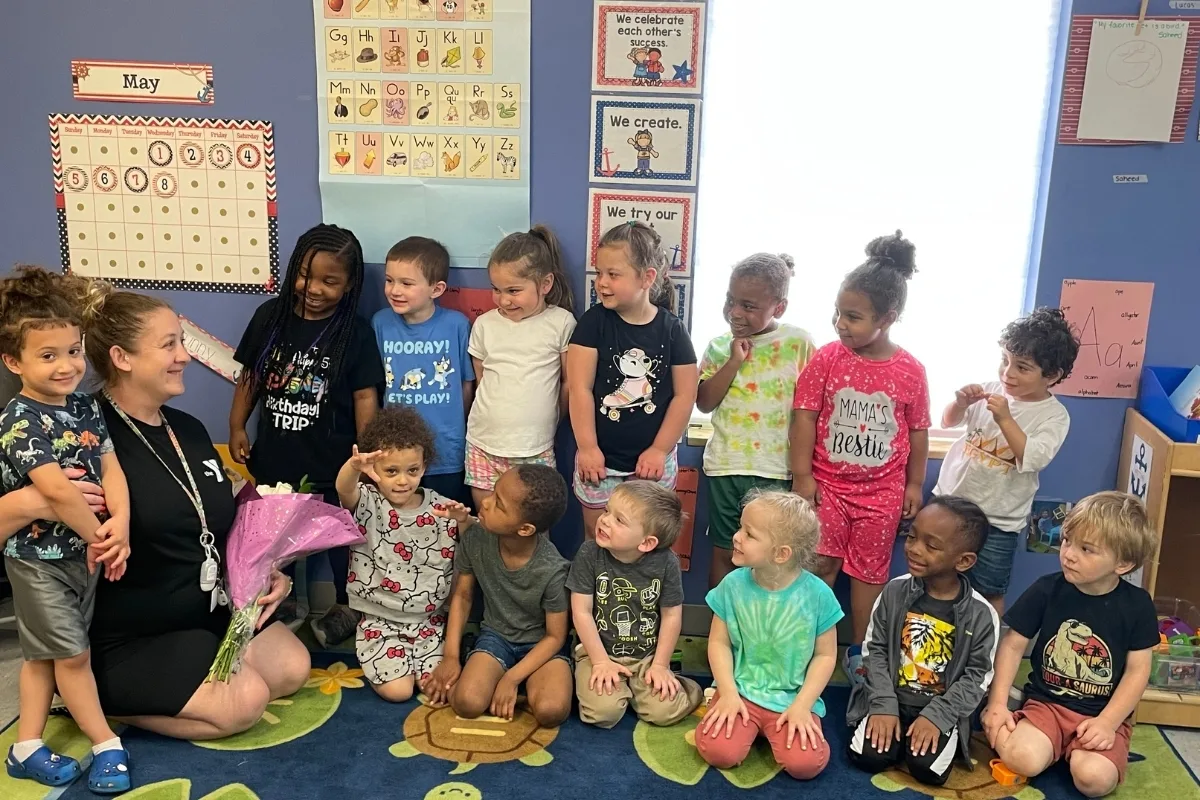 Group of children with a teaching staff member in a classroom