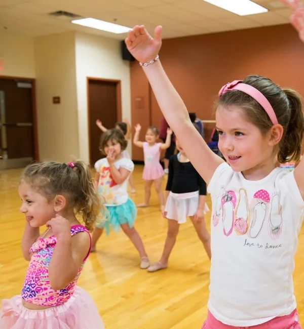 Youth dancers practicing ballet in a studio