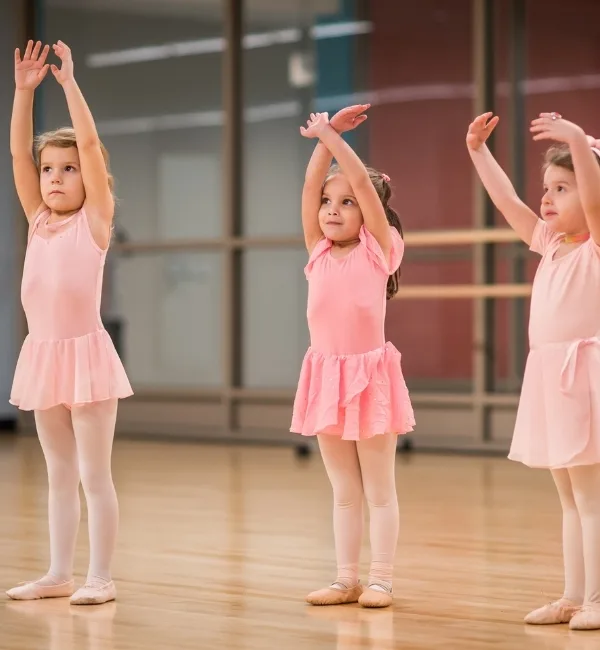 Children practicing ballet in a studio