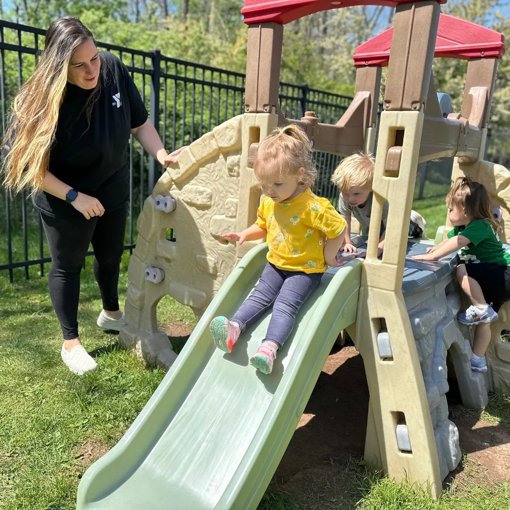 Children playing on playground slide