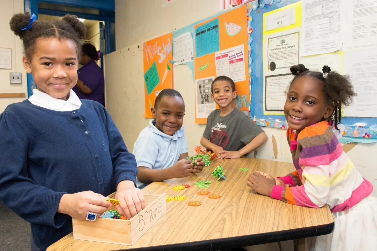Children playing with toys in a classroom
