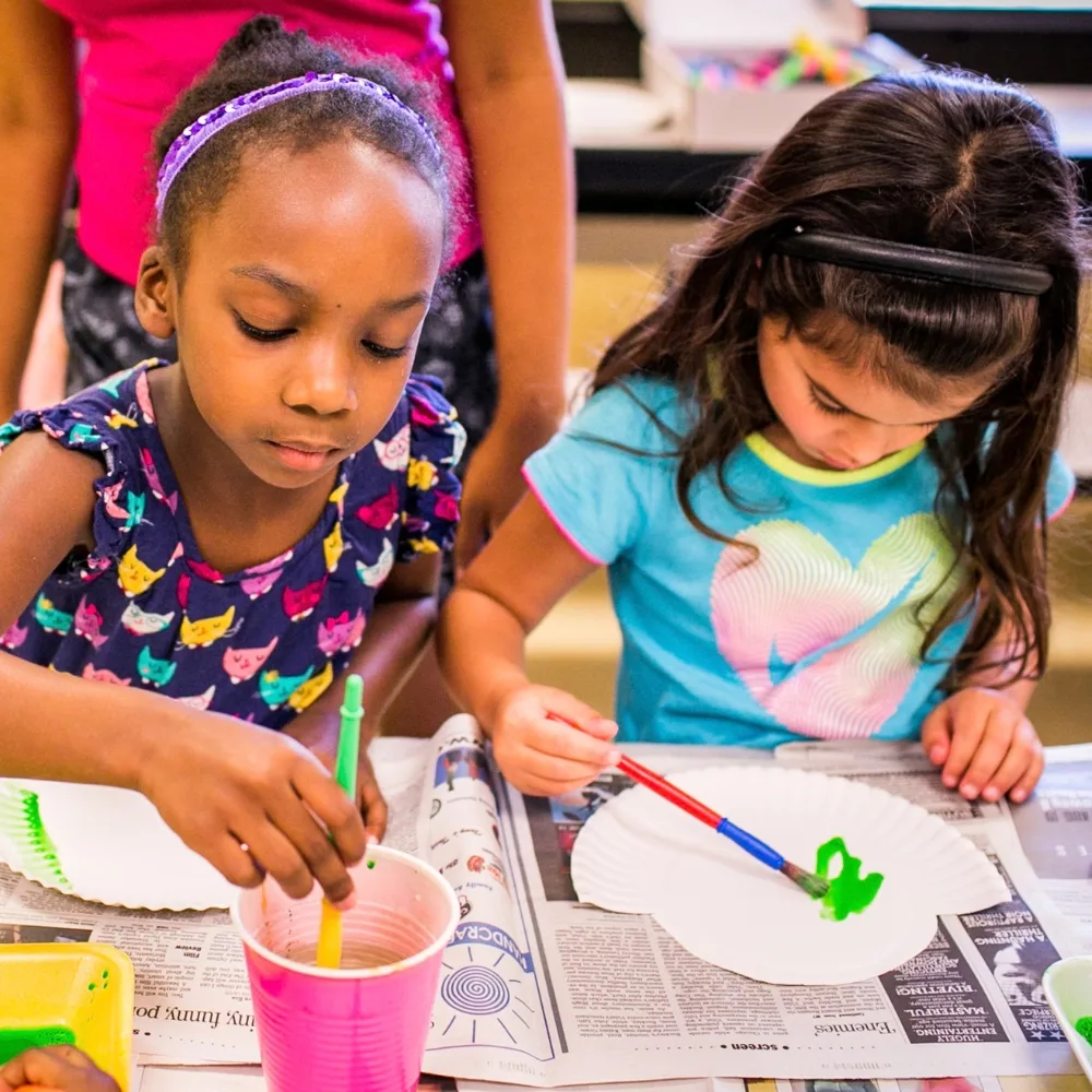 Children painting in classroom