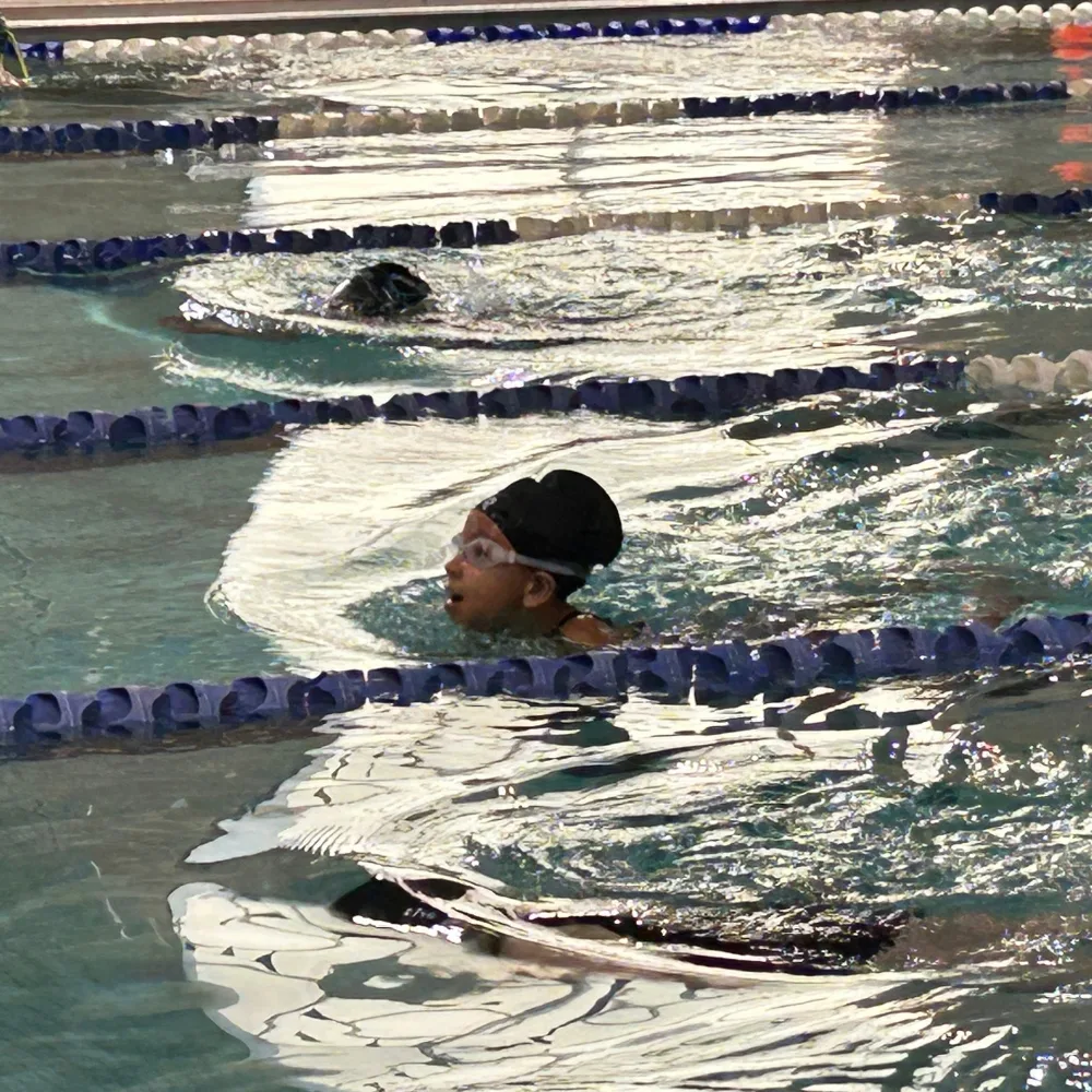 Greater Philadelphia Y's youth swim team in an indoor pool