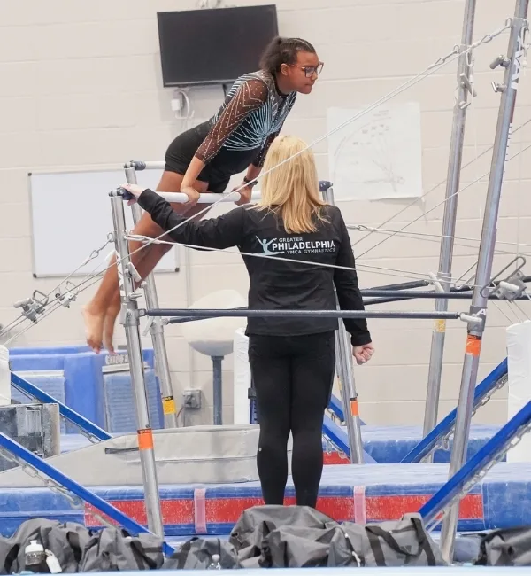 Youth gymnastics athlete at a competition inside a gymnastics facility