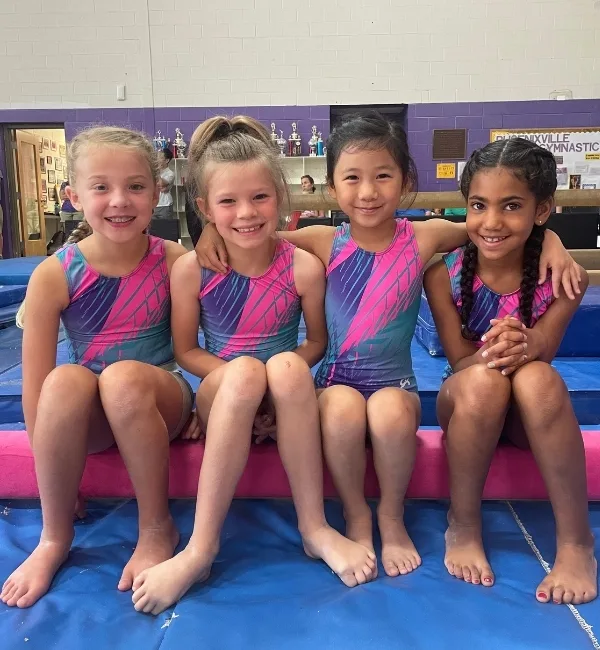 Youth gymnastics athletes at a competition at a gymnastics facility
