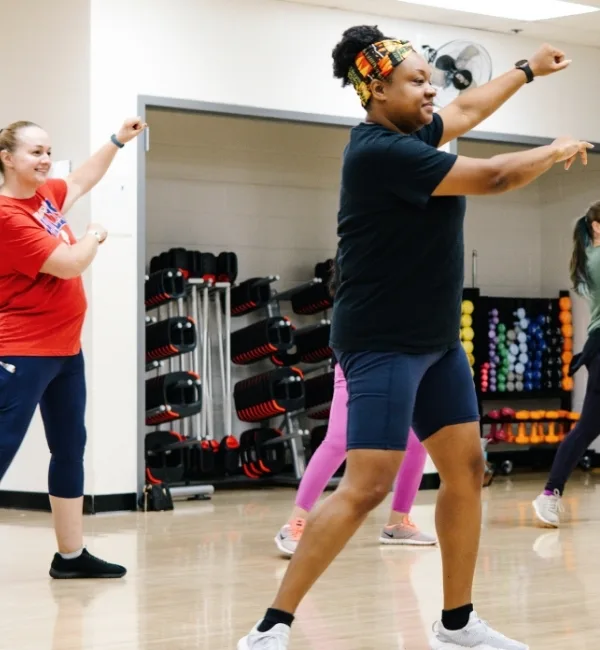 Group Zumba dance exercise class in a studio