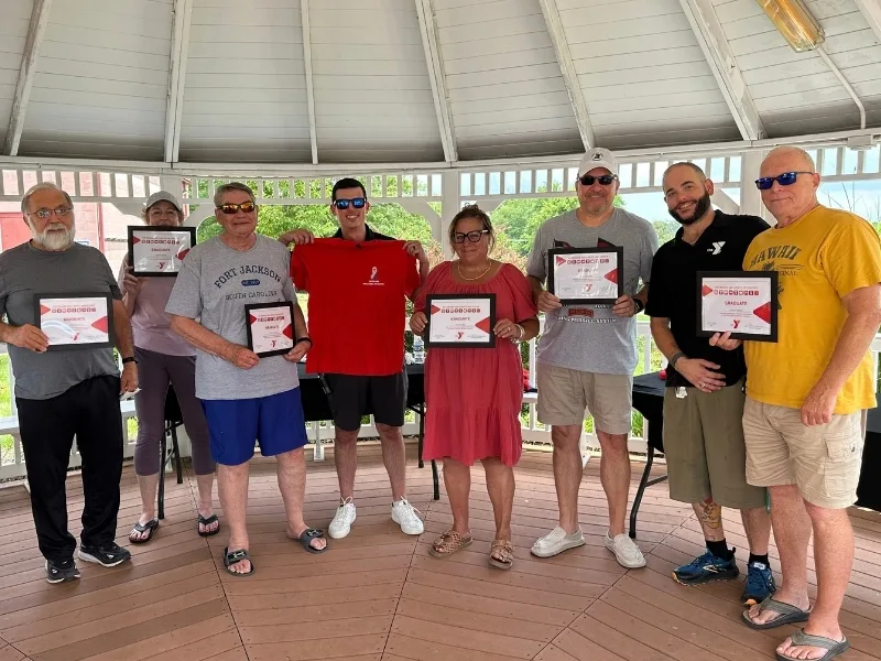 Group of people standing under gazebo at Spring Valley Y's Veterans Wellness event