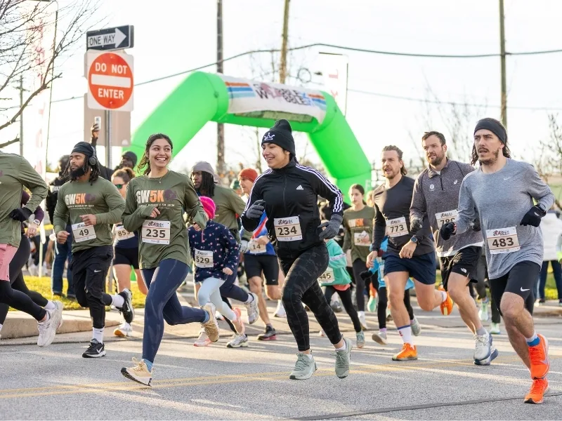Group of people running at Y's Gobble Wobble 5K event