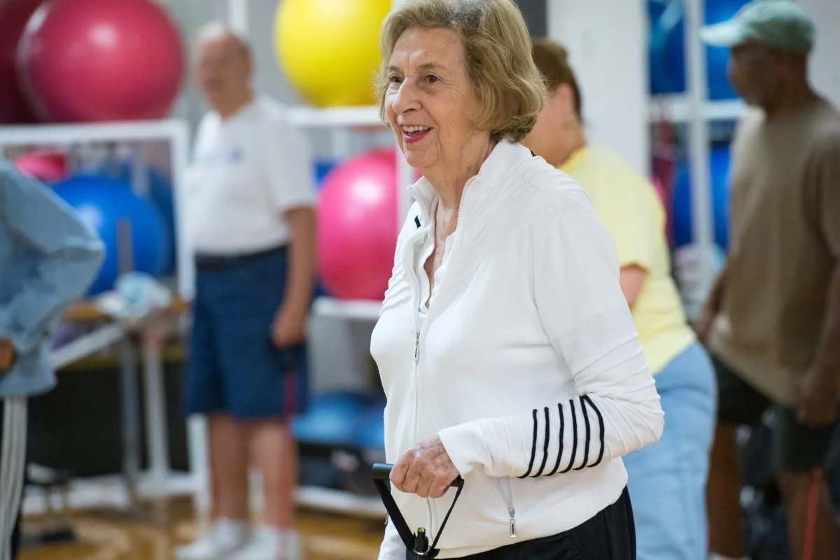 Member exercising in small group exercise in a studio