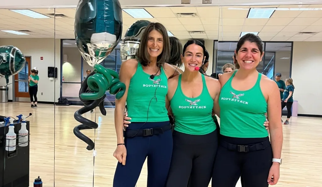 Les Mills Bodycombat trainers wearing Eagles merch in studio