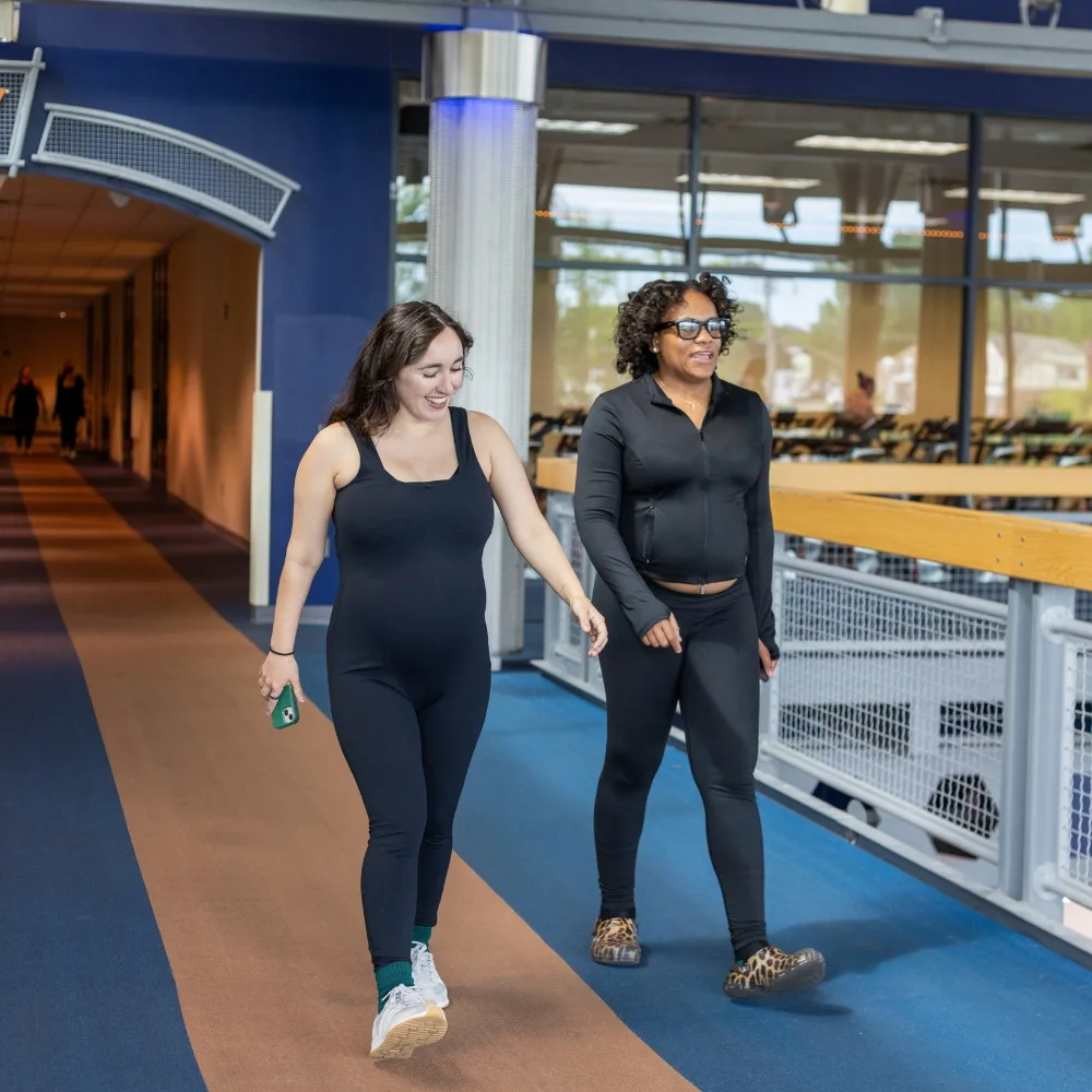 Members walking on indoor track during Maternal Wellness group exercise