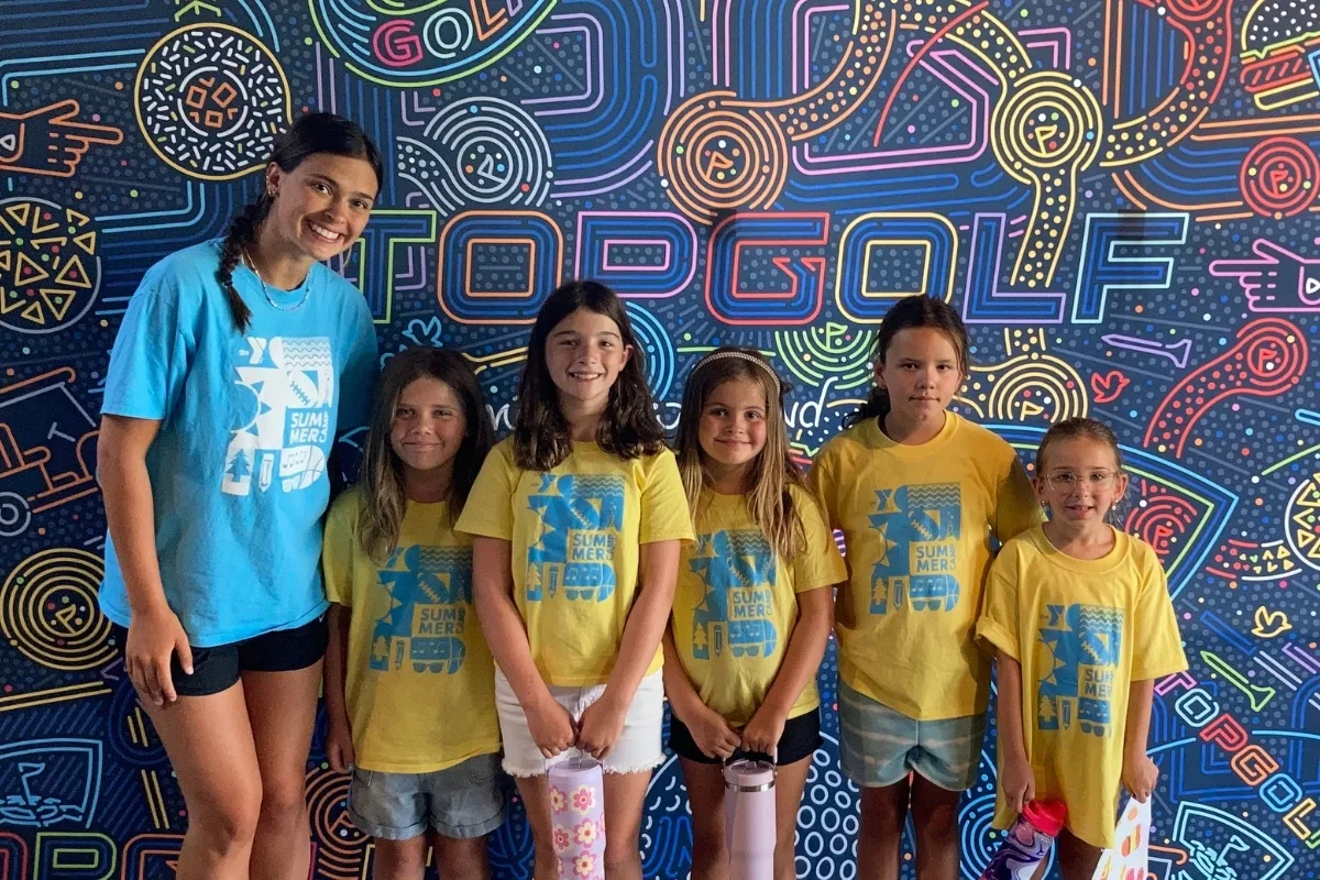 Mount Laurel Y's summer campers and camp counselor on a field trip to Top Golf