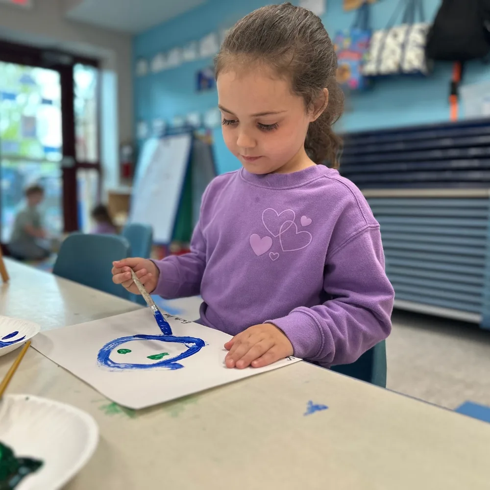 Child panting in a classroom