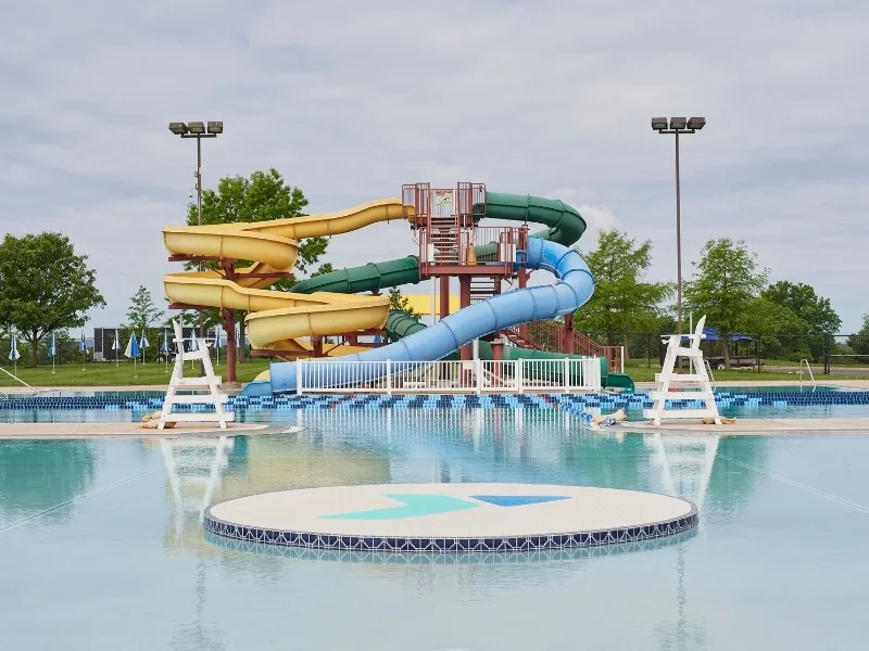 Outdoor pool with slides at Spring Valley Y