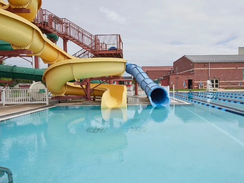 Outdoor pool with slides at Spring Valley Y