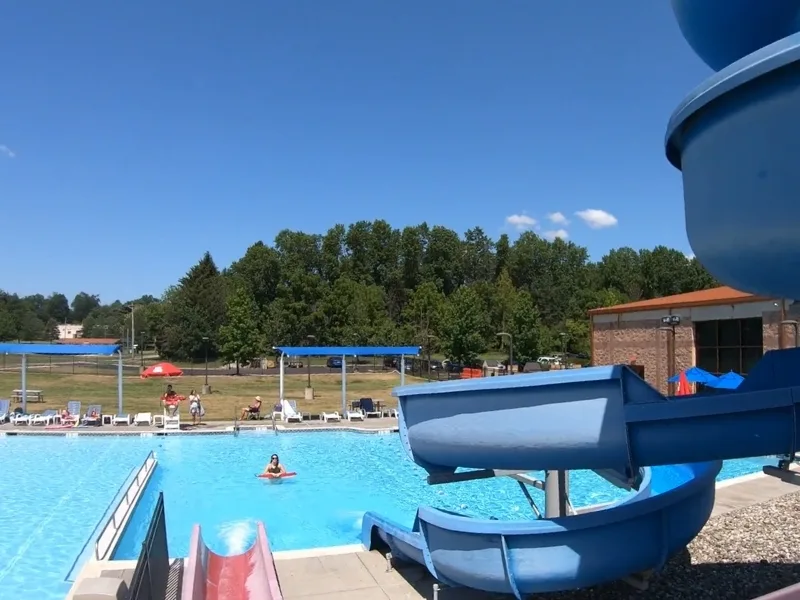 Outdoor pool with slides at Ambler Y