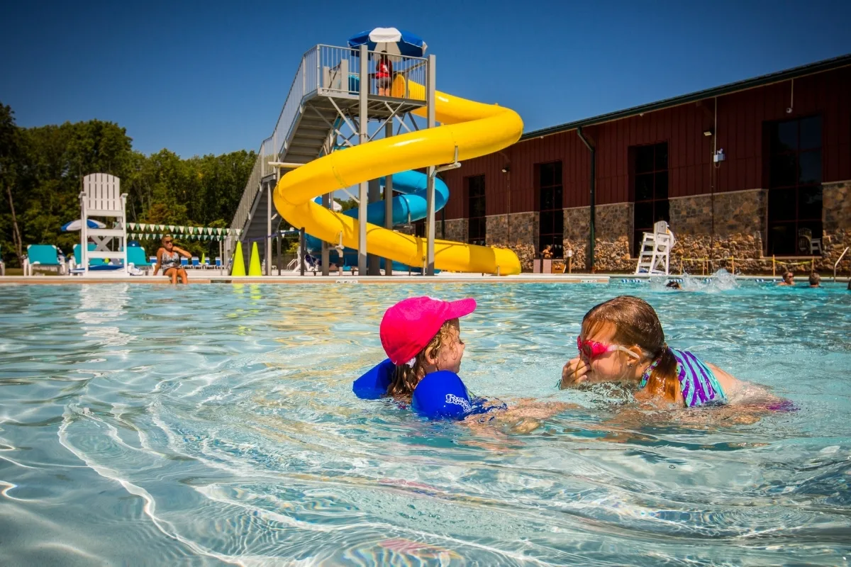 Outdoor pool with slides at Upper Perkiomen Valley Y