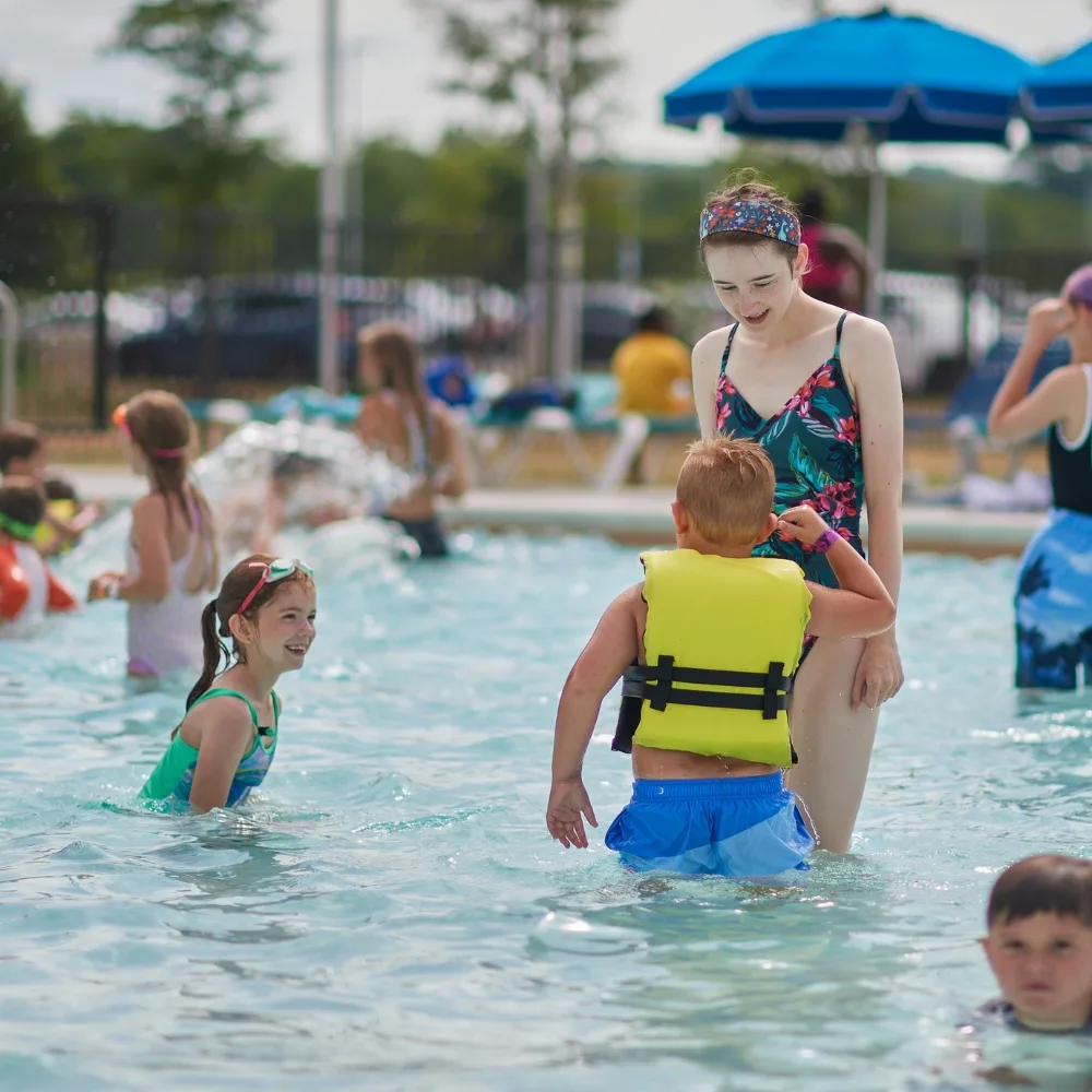 Children playing in outdoor pool at Upper Perkiomen Valley Y