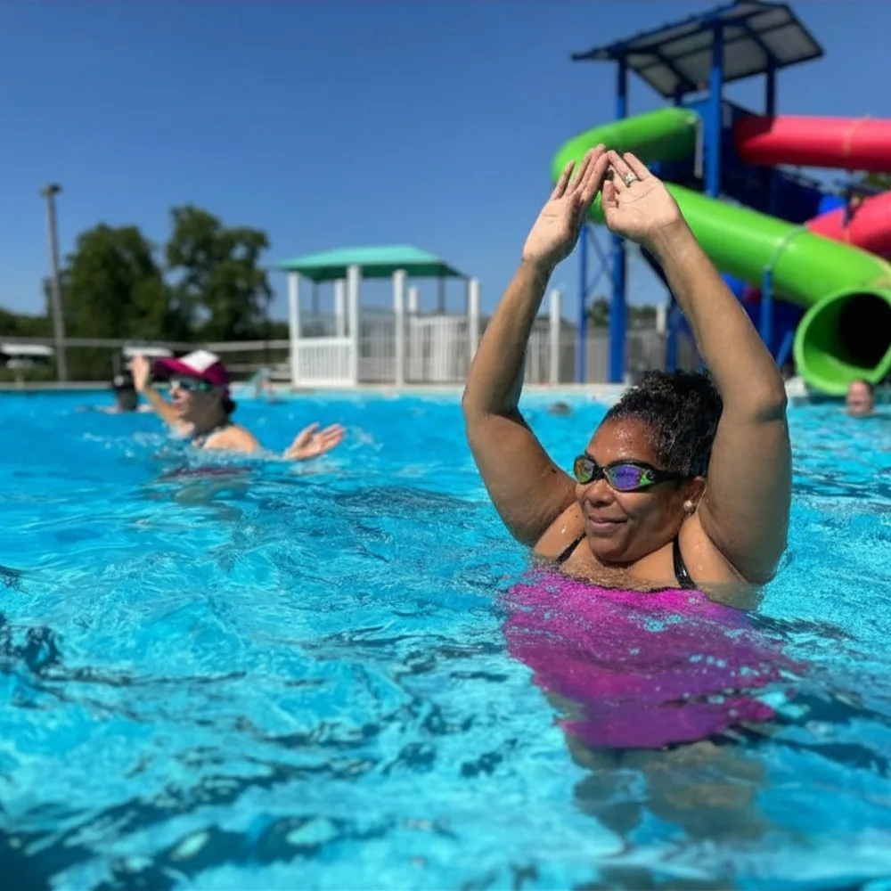 Aquatic group exercise in an outdoor pool