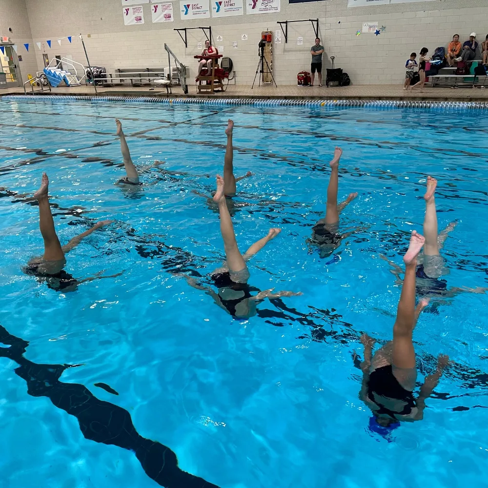 Phoenixville Y's synchronized swim team in indoor pool