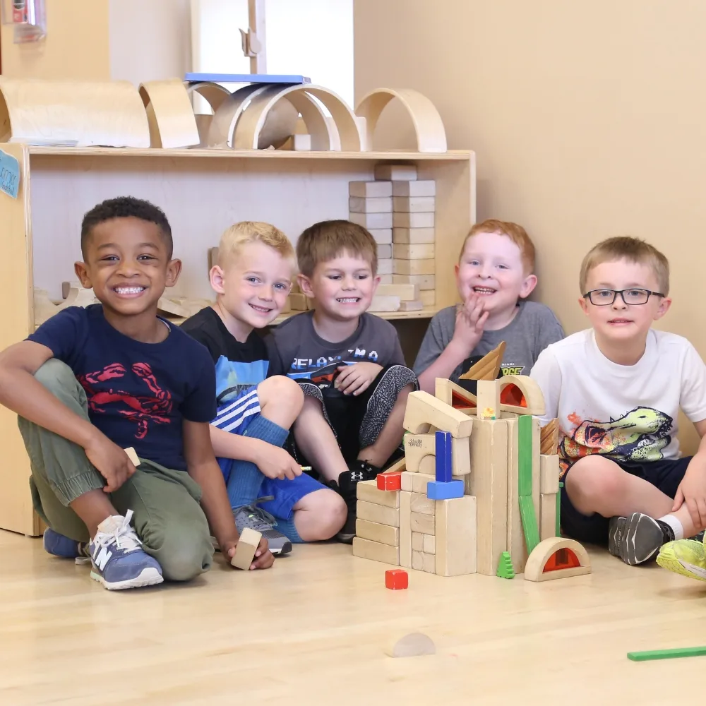 Group of children playing with toys in a classroom