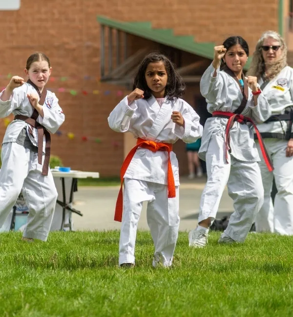 Children practicing martial arts outside