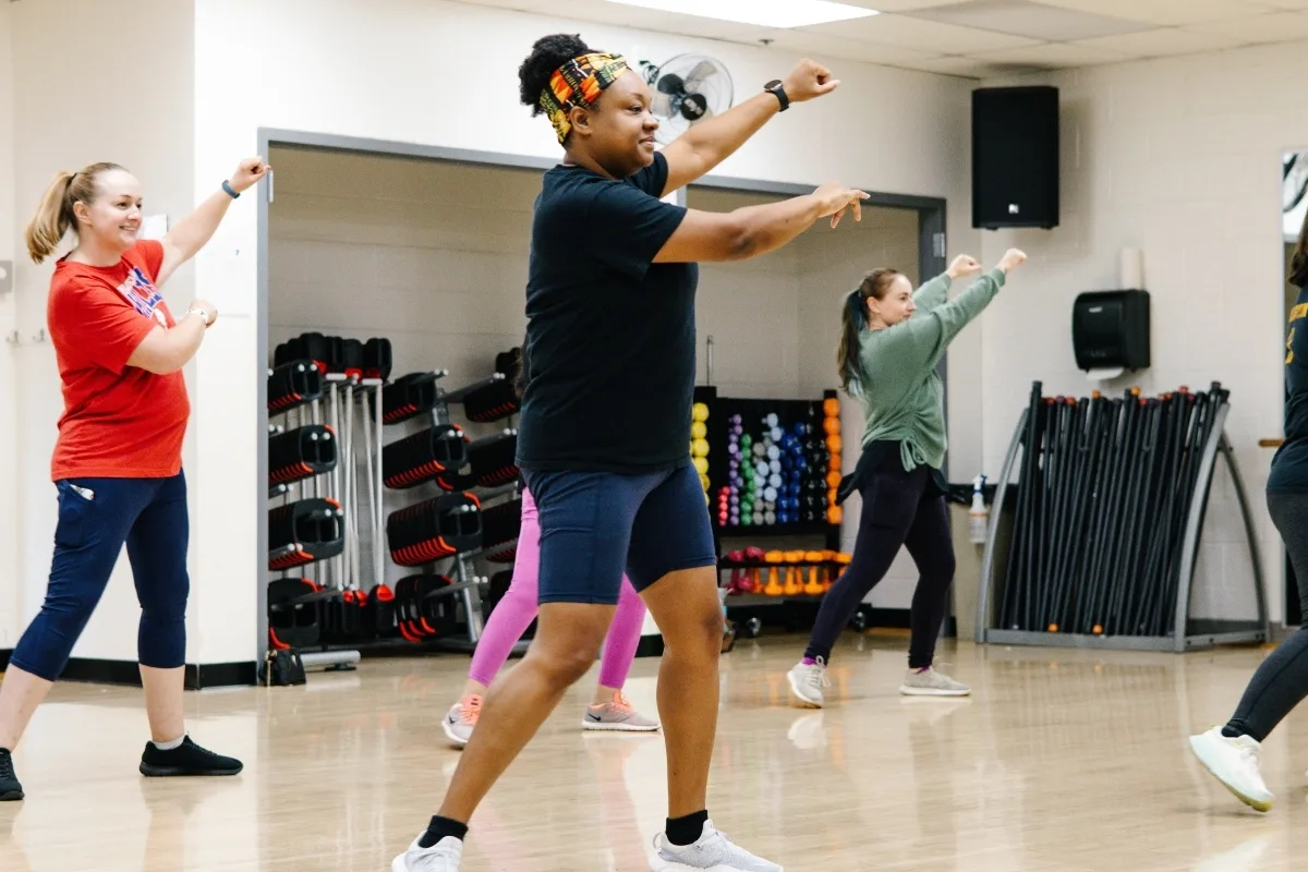 Group Zumba dance exercise class in a studio