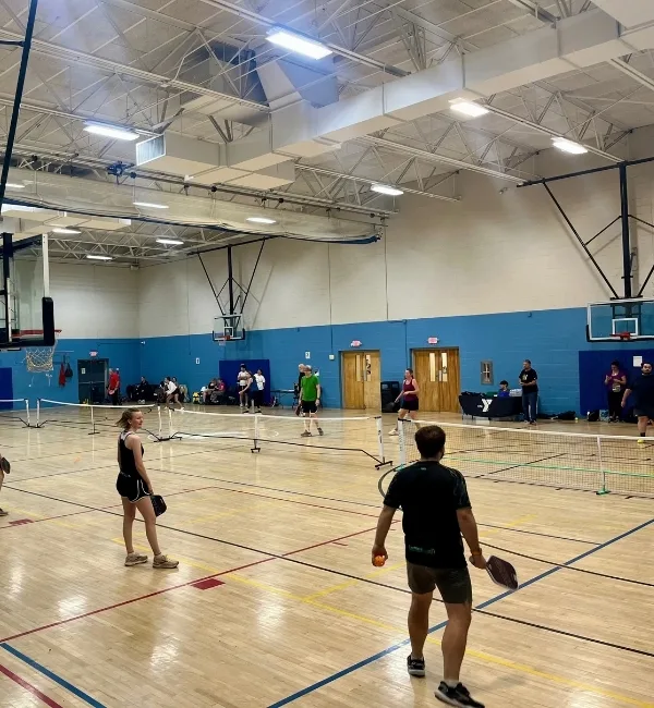 Pickleball games inside gymnasium