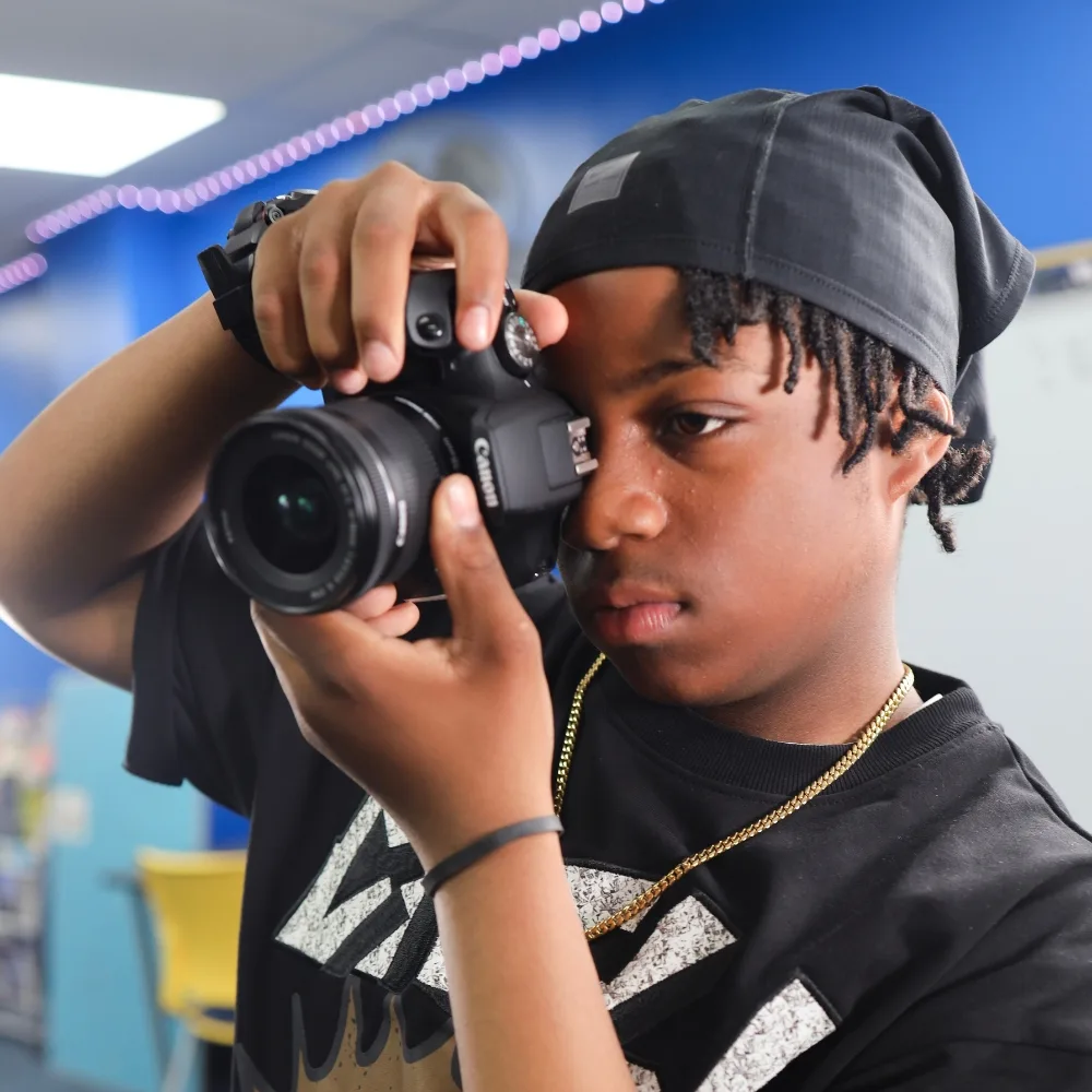 Teen using camera in Teen Tech Center at Columbia North Y