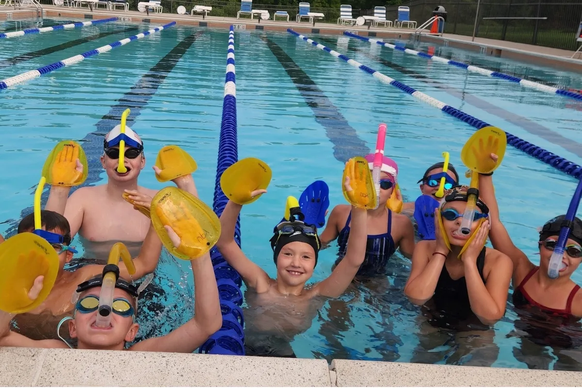Upper Perkiomen Valley Y's youth swim team with snorkeling equipment at outdoor pool