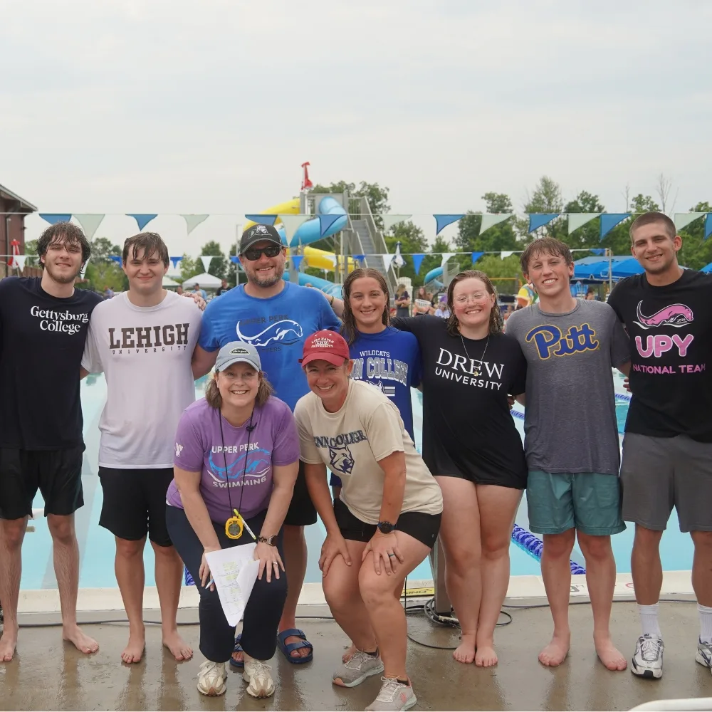 Upper Perkiomen Valley Y's youth swim and coaches team at outdoor pool