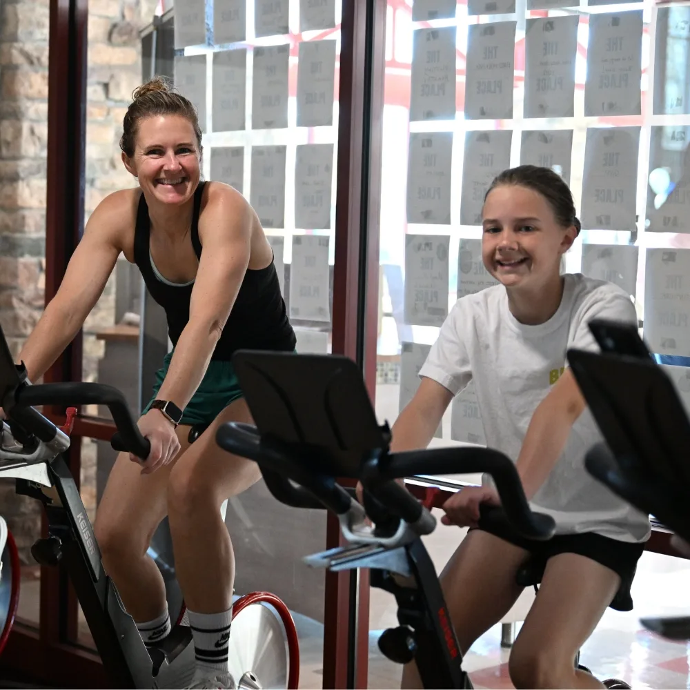 Mom and daughter on exercise bikes at Spring Valley Y