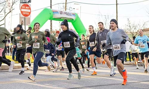 People running during 5K running event