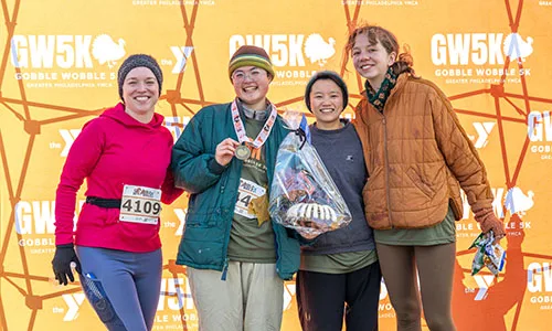 Group of 5K running finishers smiling