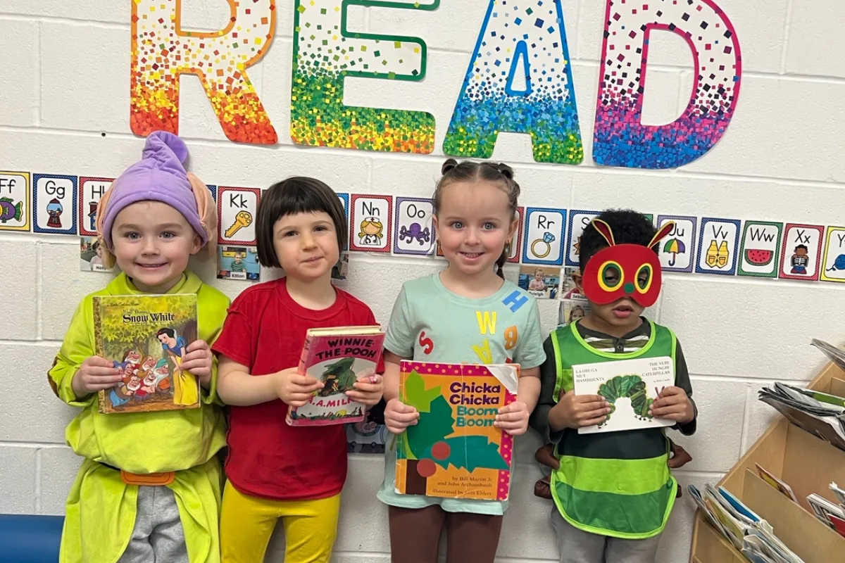 Students with books at Northeast Family YMCA Early Learning Center