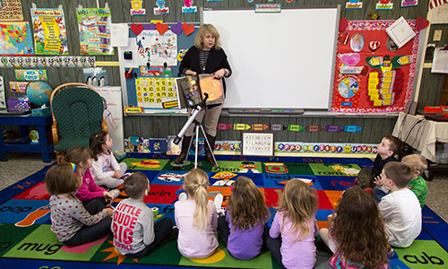 Teacher Reading to Kids