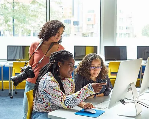 Teens working on photography editing